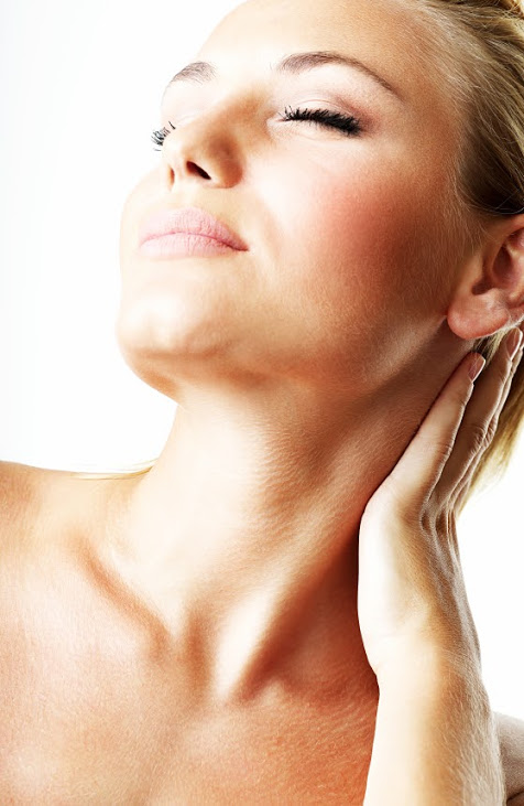 A woman touching her neck after surgery by Premier Plastic Surgery Arts in Sewell, NJ